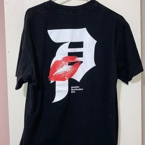 A size large, black Primitive Skateboarding shirt.
